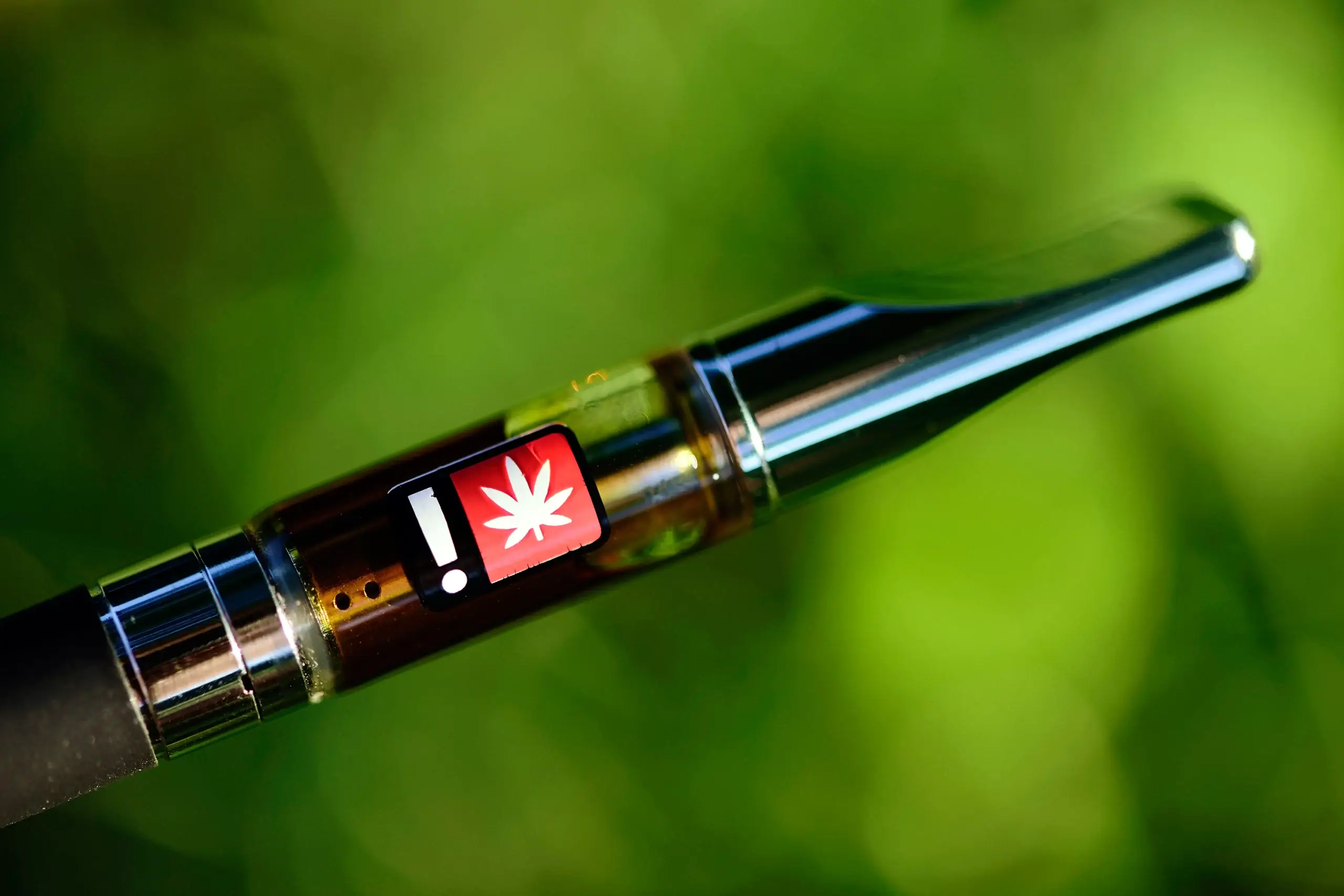 Cannabis 510-thread cartridge attached to a vape pen battery in the format used across the Rove Classic, Featured Farms, and Live Resin product lines