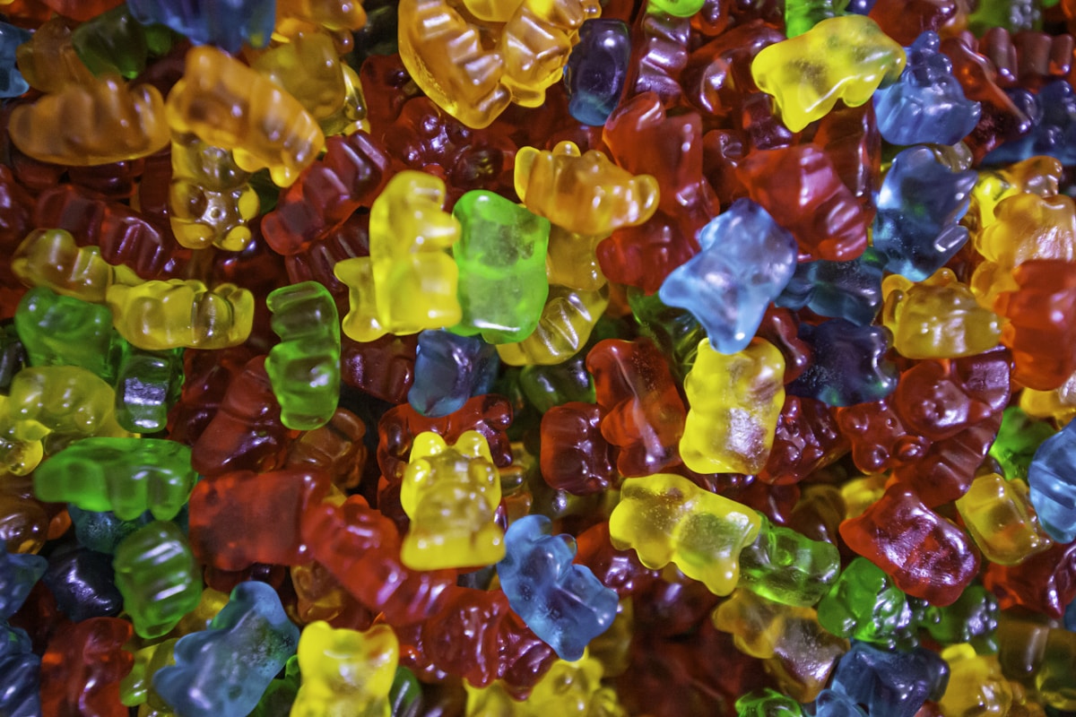 Colorful cannabis gummies in red, yellow, green, and blue, the homemade THC edible format made with gelatin or pectin and infused with decarboxylated cannabis
