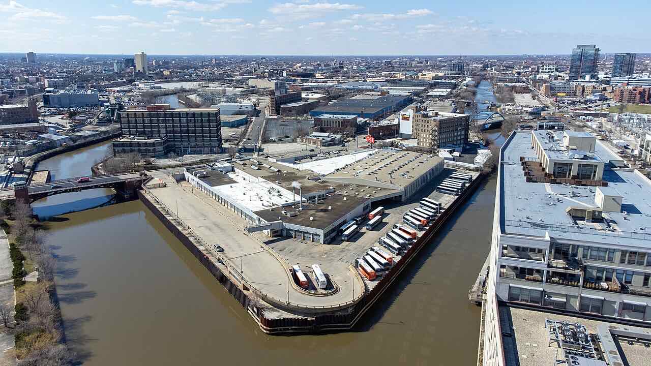 Aerial of the Goose Island warehouse corridor and the North Branch of the Chicago River with the bridge and industrial buildings, the Lincoln Park strip where Curaleaf Weed Street operates