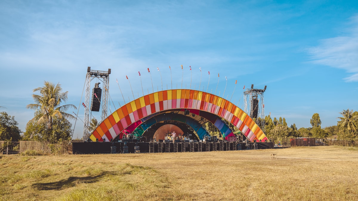 Outdoor festival main stage at dusk on the polo grounds near the El Paseo and STIIIZY Palm Desert dispensary corridor