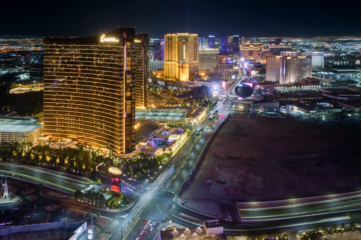 The Las Vegas Strip skyline at night looking north from Resorts World, with Wynn and the Sphere visible above the corridor where the city's licensed dispensaries cluster.