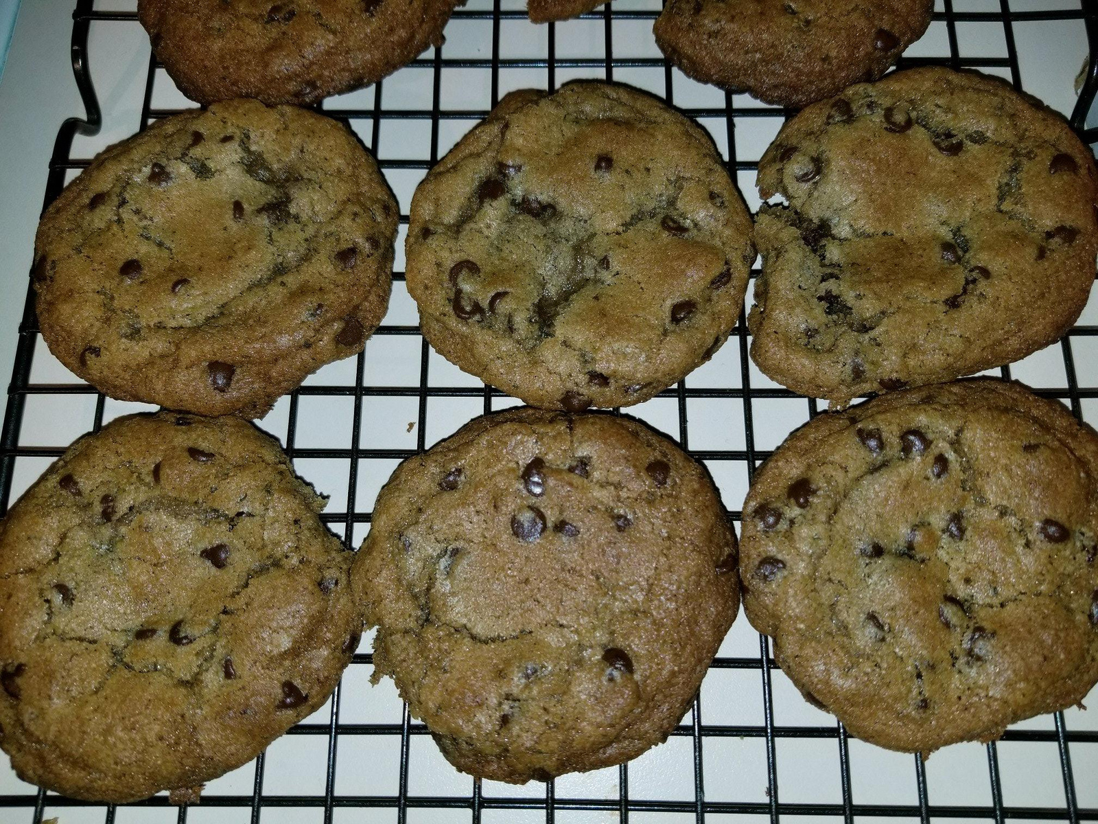 Cannabis-infused chocolate chip cookies on a wire cooling rack, representative of the artisan-baked edible category Nature's Grace and Wellness produces from its Vermont, Illinois cultivation and processing facility