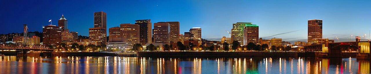 Portland Oregon city skyline at night with bridges and Willamette River