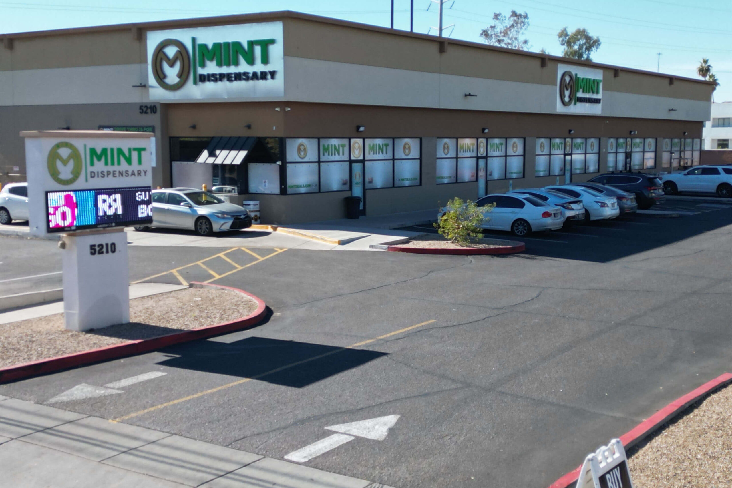The Mint Cannabis Tempe storefront at 5210 with parking lot and dispensary signage