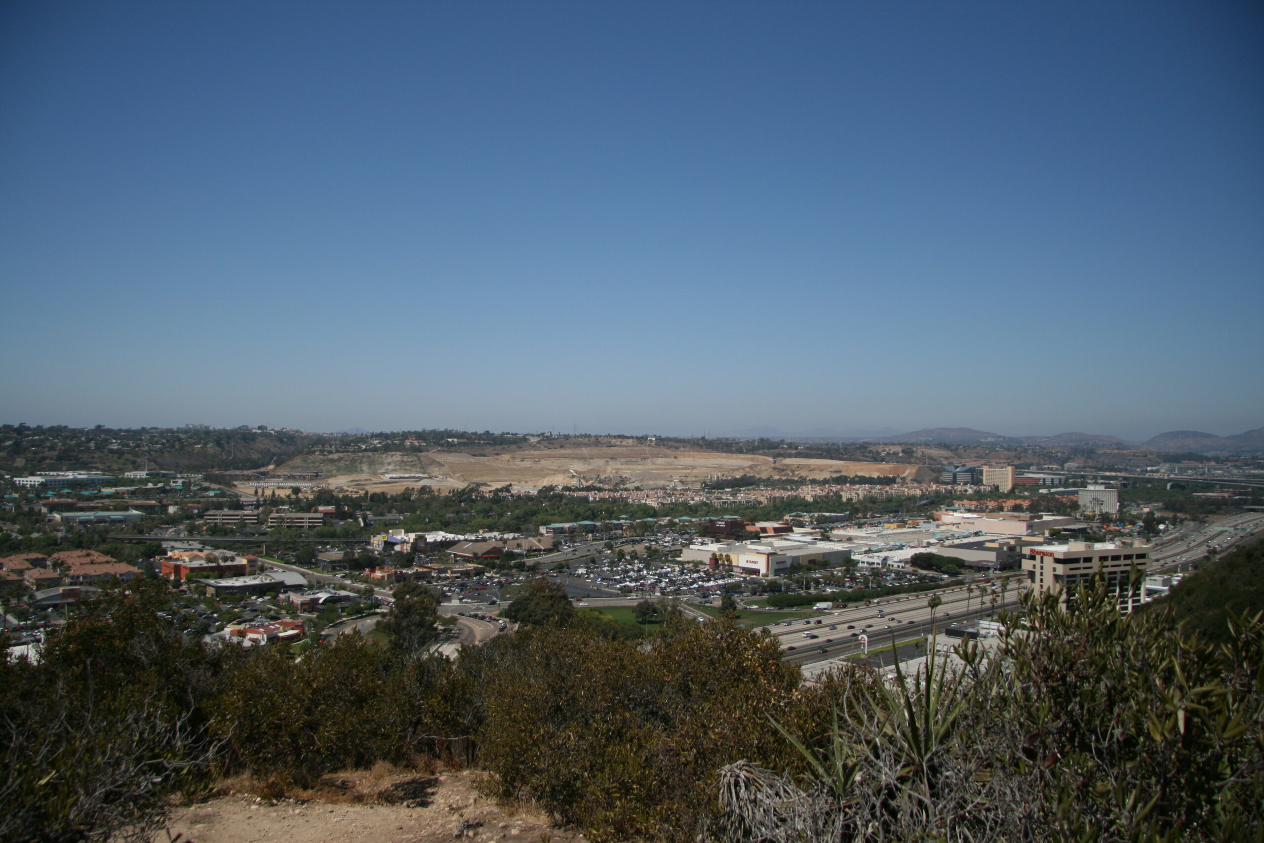 Mission Valley San Diego viewed from University Heights with shopping centers and the Camino Del Rio commercial corridor below