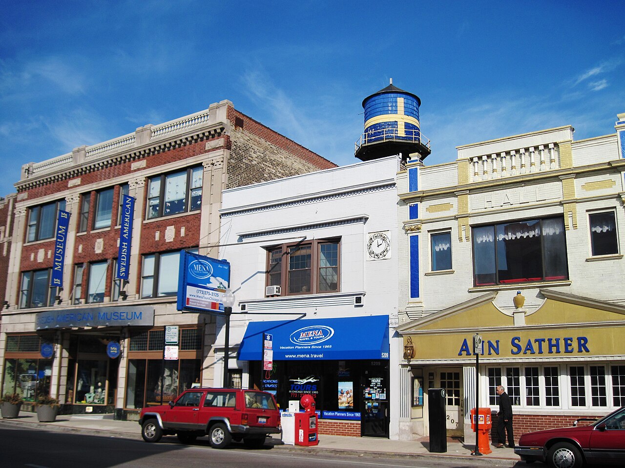 Andersonville Clark Street with the Swedish American Museum, Ann Sather restaurant, and the iconic Swedish flag water tower painted blue and yellow, the block where Dispensary 33 sits at 5001 North Clark in Chicago