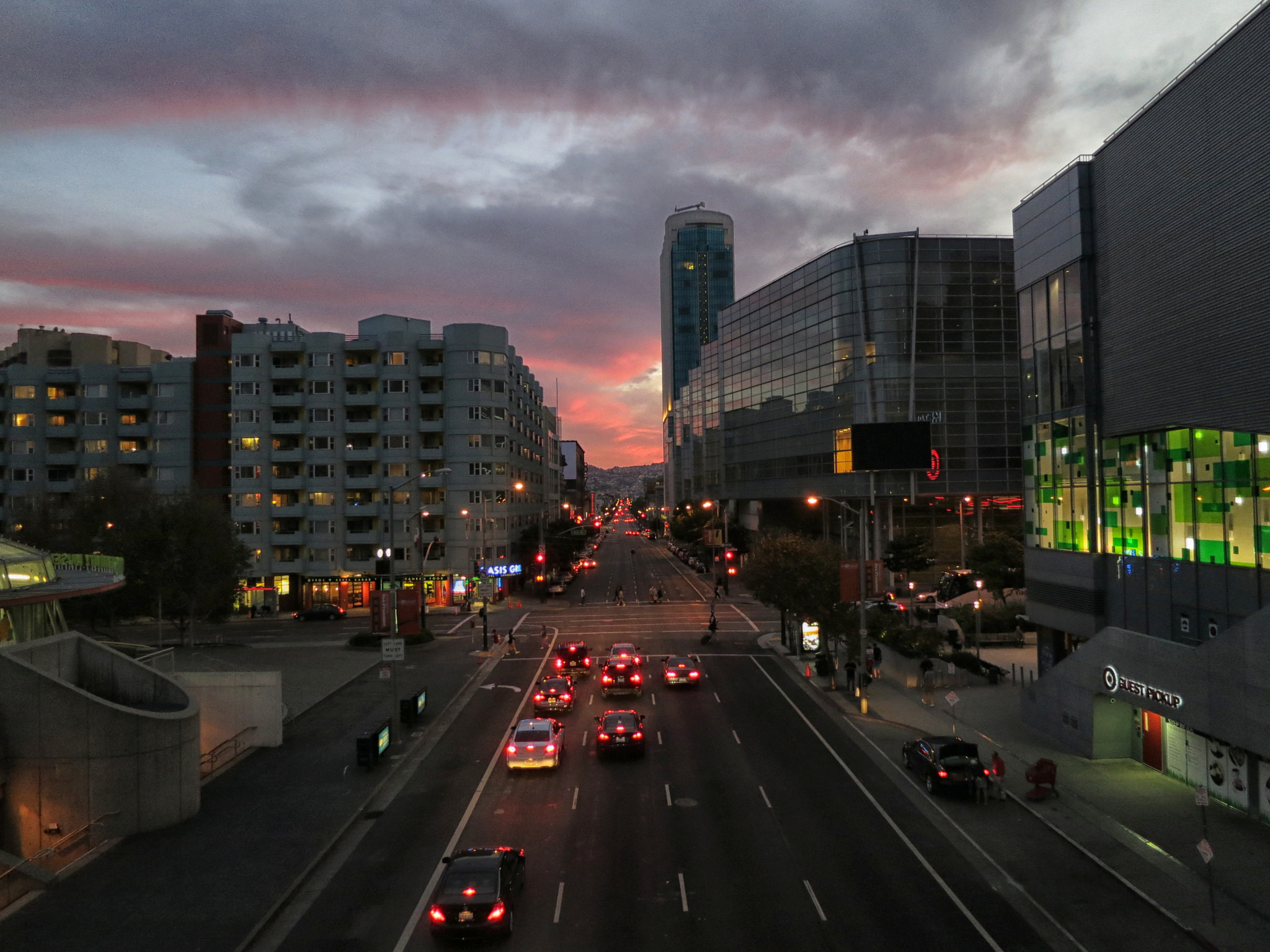 Howard Street in the SoMa neighborhood of San Francisco at sunset with car traffic and Yerba Buena buildings near The Apothecarium SoMa
