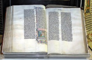 Open Bible on a stand showing the thin lightweight pages people ask about using to roll weed