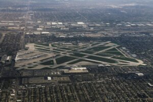 Aerial view of Chicago Midway International Airport surrounded by the Southwest Side bungalow grid, the airfield three blocks south of Ascend Midway dispensary on Archer Avenue